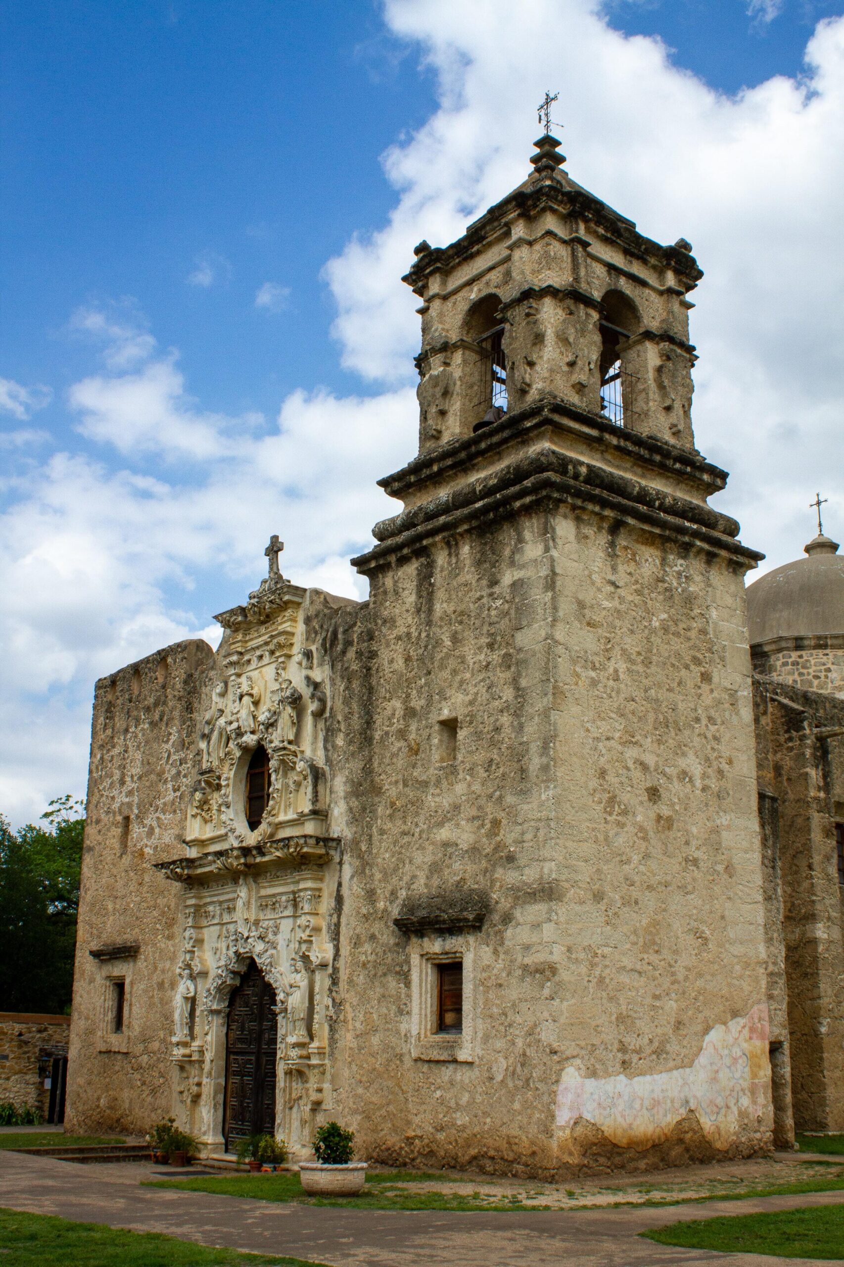 Historic stone church with bell tower.